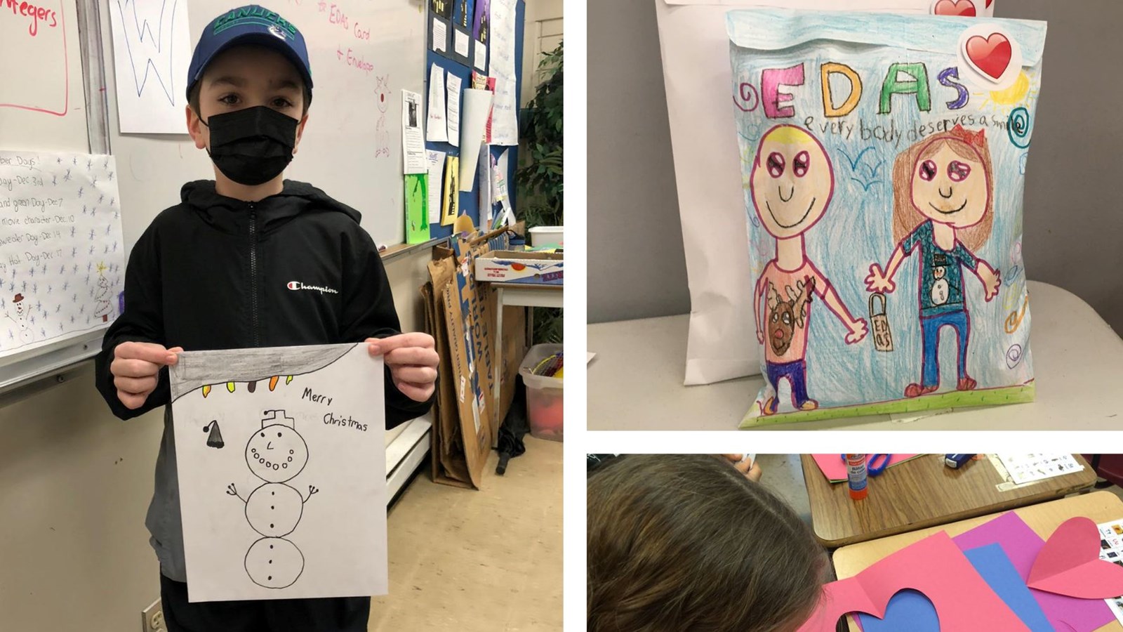 Student holding a drawing of a snowman.